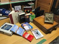 Overview of cabinet, metronome, books and file holders on tabletop