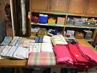 Tabletop view of all blankets showing variety of colours and sizes