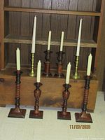 All eight candlesticks with six taper candles displayed