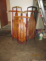 Group shot of three Flexible Flyer sleds leaning together