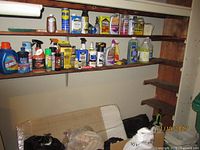 Wide view of shelves with assorted cleaning and garden products