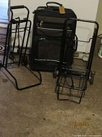 Suitcase and both folding carts standing together