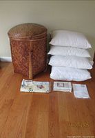 Group shot showing hamper, pillows, and linens