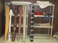 Plastic shelving with fabric rolls