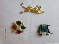 Front view of all three brooches