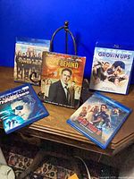 Five Blu-ray movie cases arranged on table