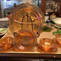 Front view showing all eight carnival glass pieces