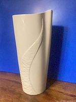 Full view of Belleek white porcelain vase showing wave motif