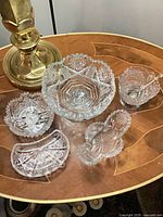 Group shot of five cut crystal pieces on table