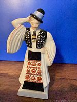 Front view of Herend porcelain male dancer figurine