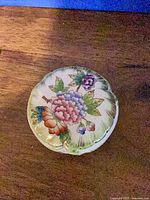 Top view of covered dish displaying floral and butterfly decoration