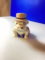 Front view of ceramic bulldog figurine with bowler hat