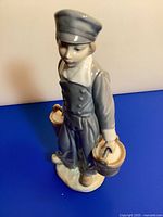 Front three-quarter view of Lladro Dutch boy figurine
