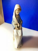 Front view of Lladro figurine showing woman with calla lilies