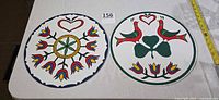 Both 16-inch Pennsylvania Dutch hex signs front view