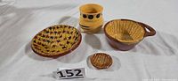 Group shot of four redware pieces