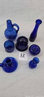 All seven cobalt glass pieces grouped