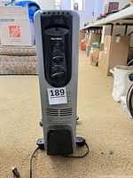 Front view showing Maxi-Heat branding, control knobs, wheels, overall condition