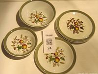 Five Alfred Meakin pieces: three bowls and two plates showing harvest motif, green rim
