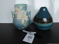 Both vases side by side with scale reference