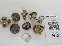 Group shot of all nine costume rings