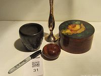 Group shot of all four decor pieces with scale pen