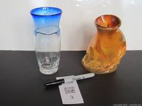 Both vases side by side with scale pen