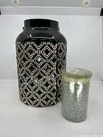 Lantern and sealed candle side by side