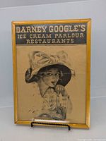 Full view of framed advertising print