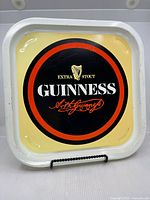 Front view of square Guinness metal tray
