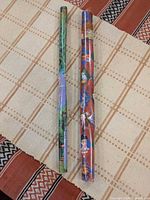 Two rolls of Harry Potter gift wrap side by side