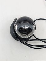 Front view of Logitech spherical webcam showing lens and logo