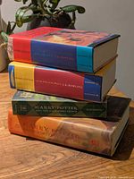 Stack of four Harry Potter hardcovers showing spine colours and dust jackets