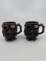 Both mugs front view showing color, design, handles