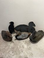 All five wooden duck decoys grouped together
