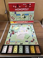 Overall view of set with board, box, money tray and components visible