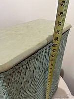 hamper side and top with tape showing approx 26 in height