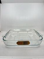Full view of clear glass Pyrex square roaster with handles