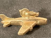 Gold airplane charm side view