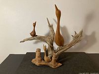 Large driftwood sculpture with three carved bird forms