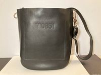 Front view showing logo, shape and leather texture