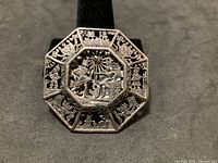 Front view showing full octagonal Egyptian motif design