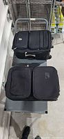 Two black rolling suitcases on cart, top and side views