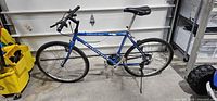 Left side view of blue Ditch Pig hybrid bicycle
