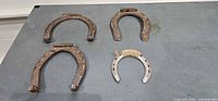 All four horseshoes on tabletop