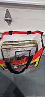Bag holding visible stack of vinyl LP records