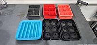 All six silicone trays displayed on countertop