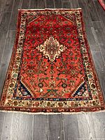 Full view of rug showing pattern and borders