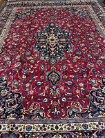 Full view of rug showing overall design, colors and condition