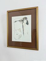 Full view of framed lithograph on wall